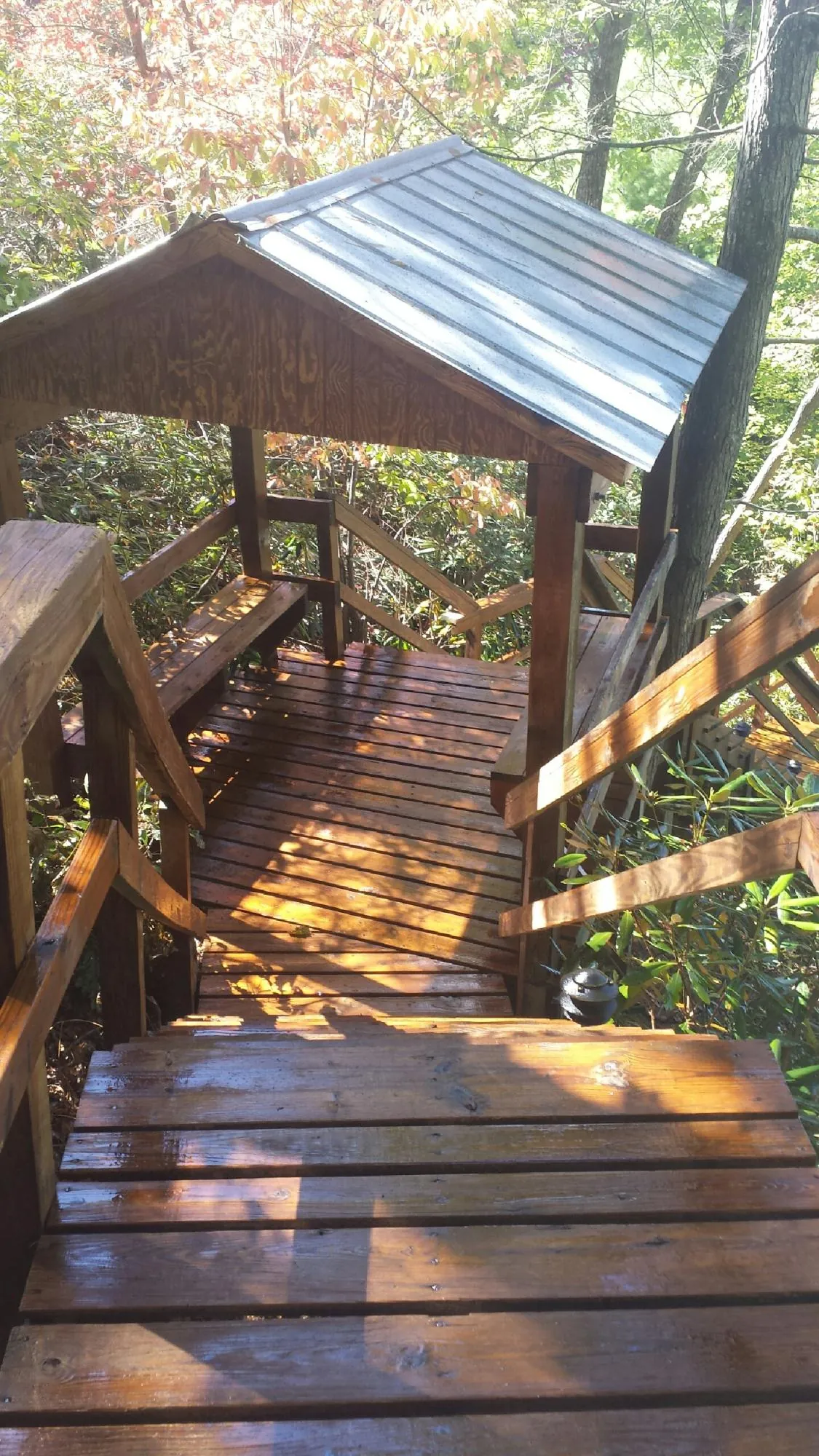 Freshly stained wood walkway and covered shelter with a metal roof in Pleasant Prairie